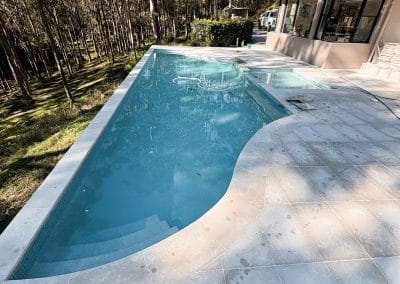 Custom concrete pool by Cove Pools
